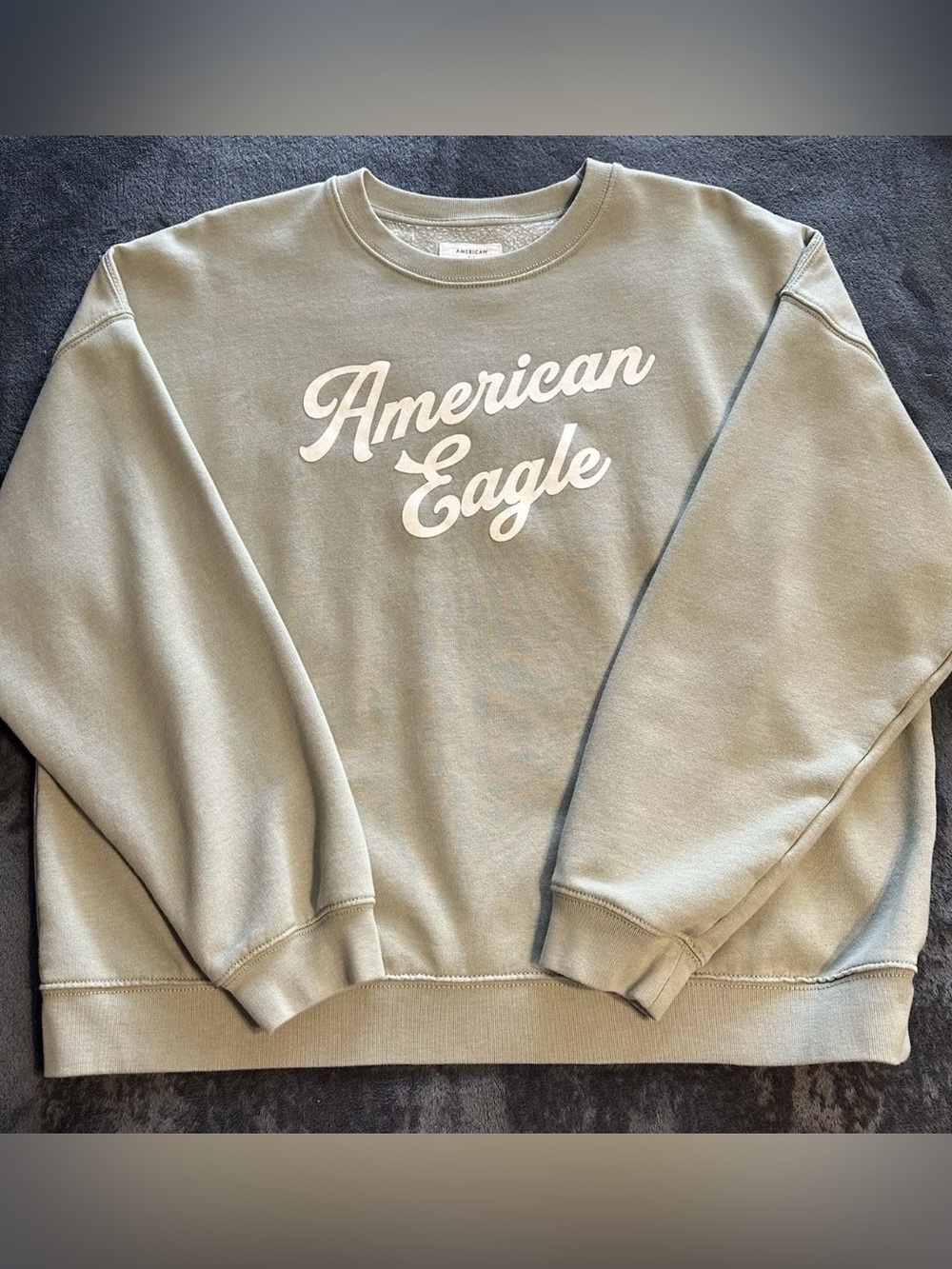 American Eagle sweatshirt size large. Color light olive/sage green w/ ivory logo